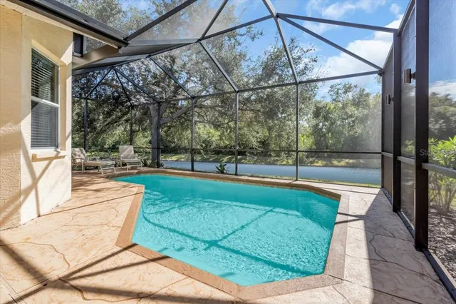 a view of a backyard with swimming pool