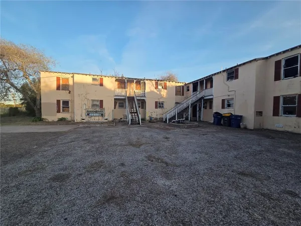 a view of a house with a back yard