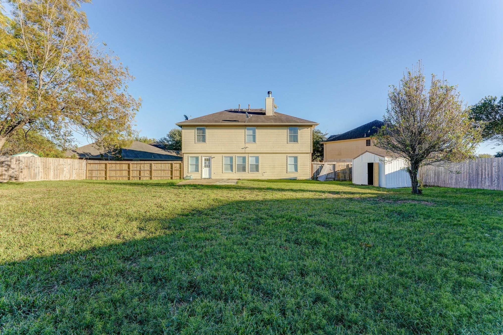 5123 Alderney Court Rosenberg, TX 77471 - Photo 8 of 9 a front view of a house with a yard