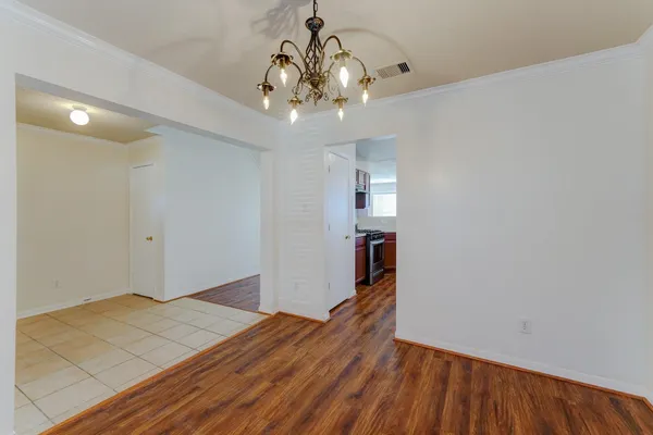 a view of livingroom with hallway and wooden floor