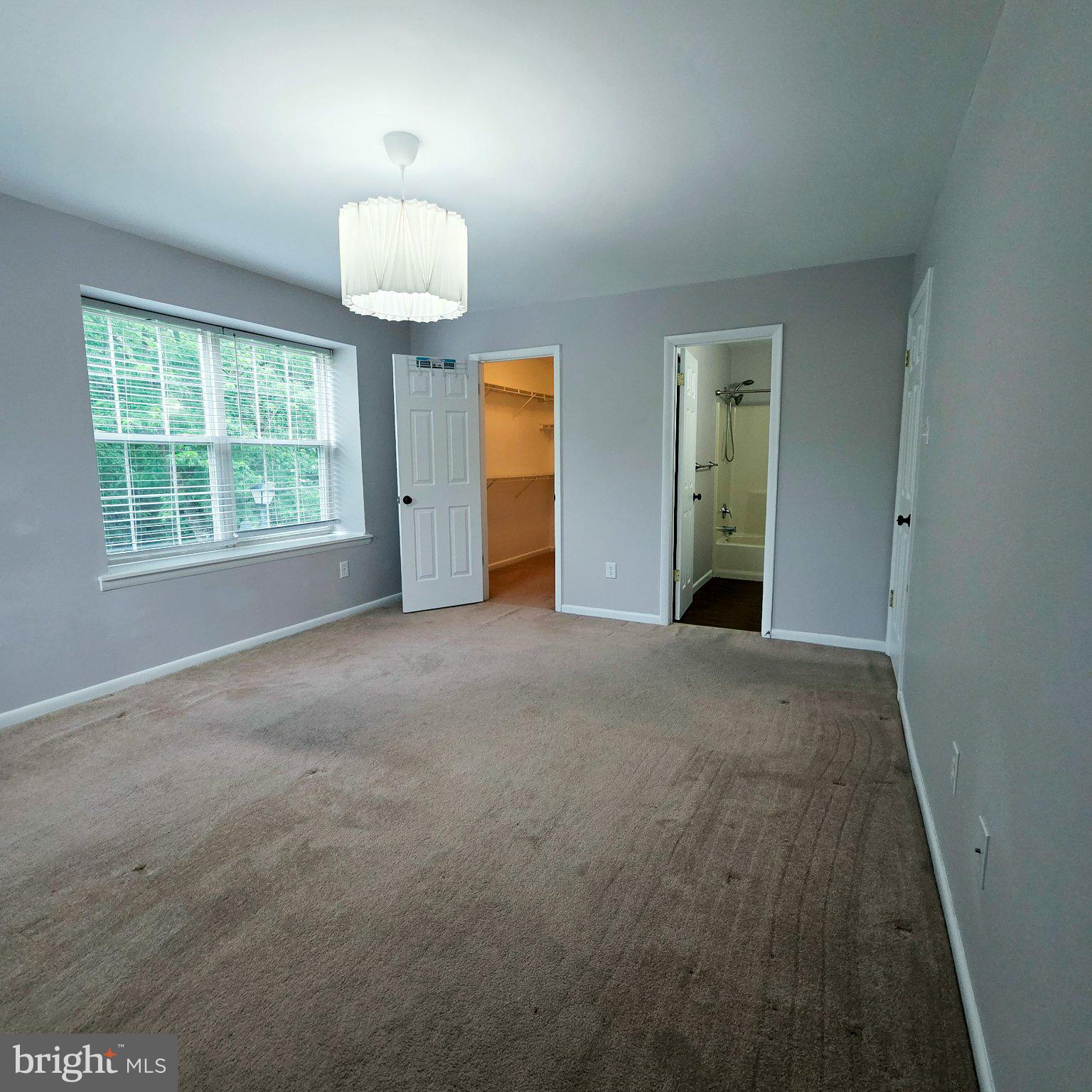 208 Ashley Run Voorhees, NJ 08043 - Photo 18 of 23 an empty room with a window and chandelier