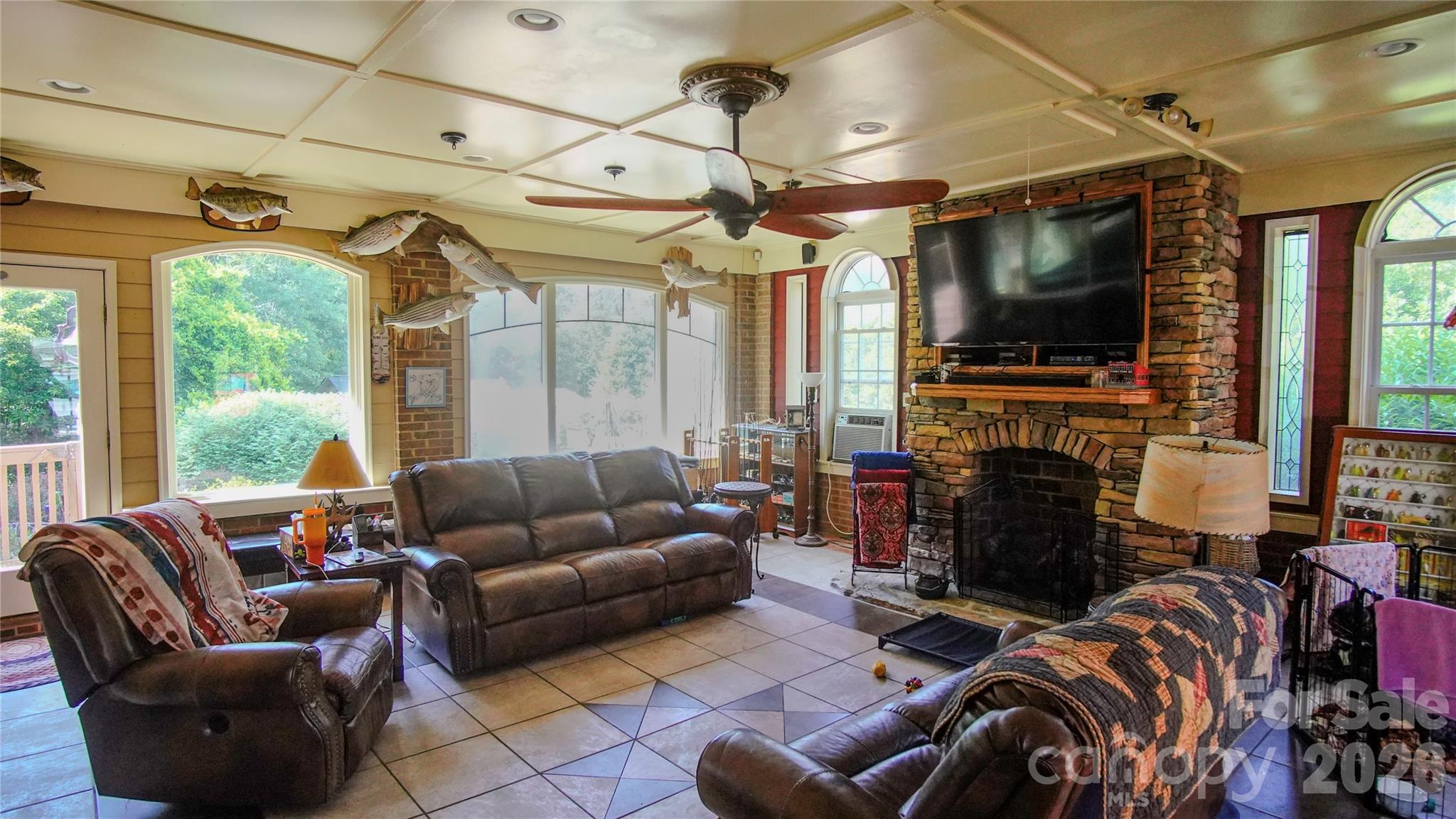 204 Old Stage Coach Road Lawndale, NC 28090 - Photo 12 of 30 a living room with furniture a flat screen tv and a fireplace