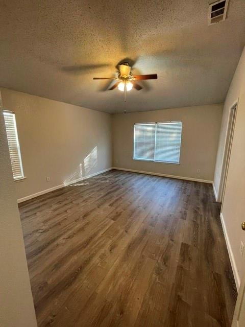 6800 Geyser Trail Watauga, TX 76137 - Photo 8 of 20 wooden floor in an empty room with a window