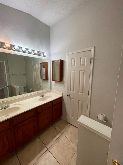 6800 Geyser Trail Watauga, TX 76137 - Photo 10 of 20 a bathroom with a double vanity sink mirror and toilet