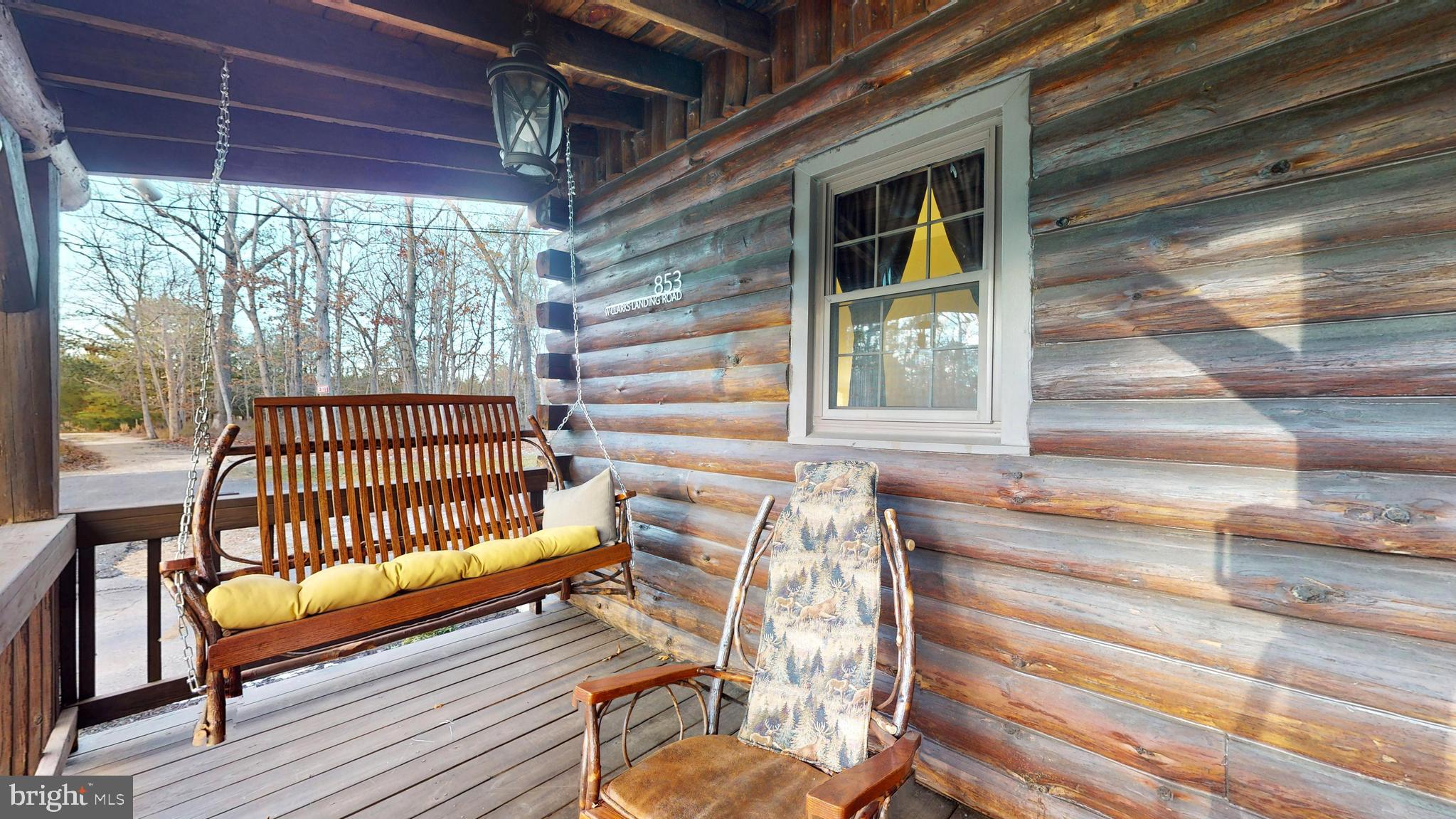 853 Clarks Landing Road Egg Harbor City, NJ 08215 - Photo 22 of 62 a view of a porch with wooden floor and outdoor space