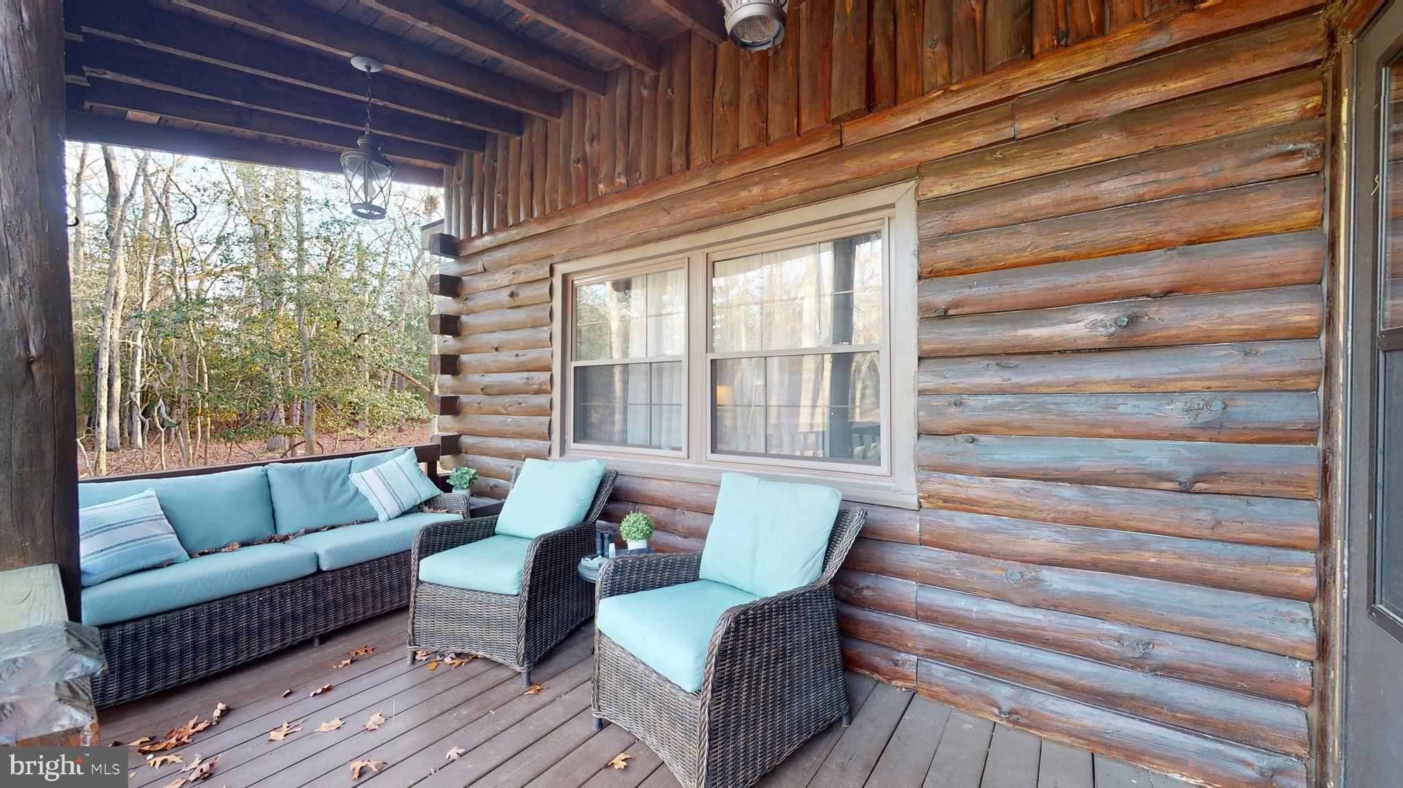 853 Clarks Landing Road Egg Harbor City, NJ 08215 - Photo 24 of 62 a living room with furniture and a large window