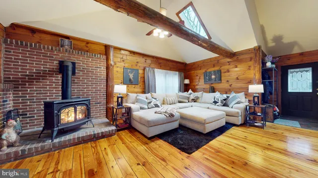 a view of living room filled with furniture and wooden floor