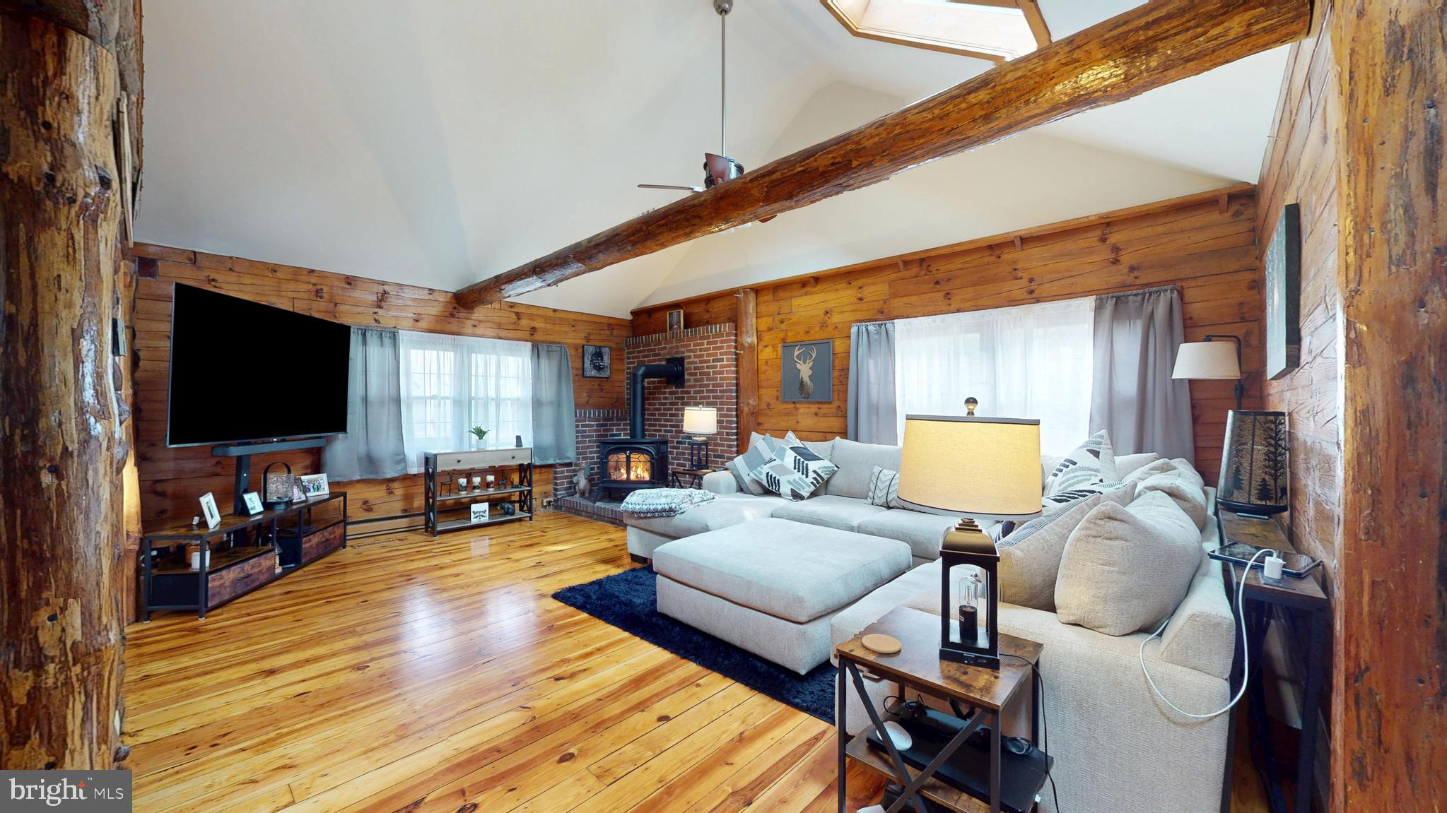 853 Clarks Landing Road Egg Harbor City, NJ 08215 - Photo 37 of 62 a living room with furniture and a flat screen tv