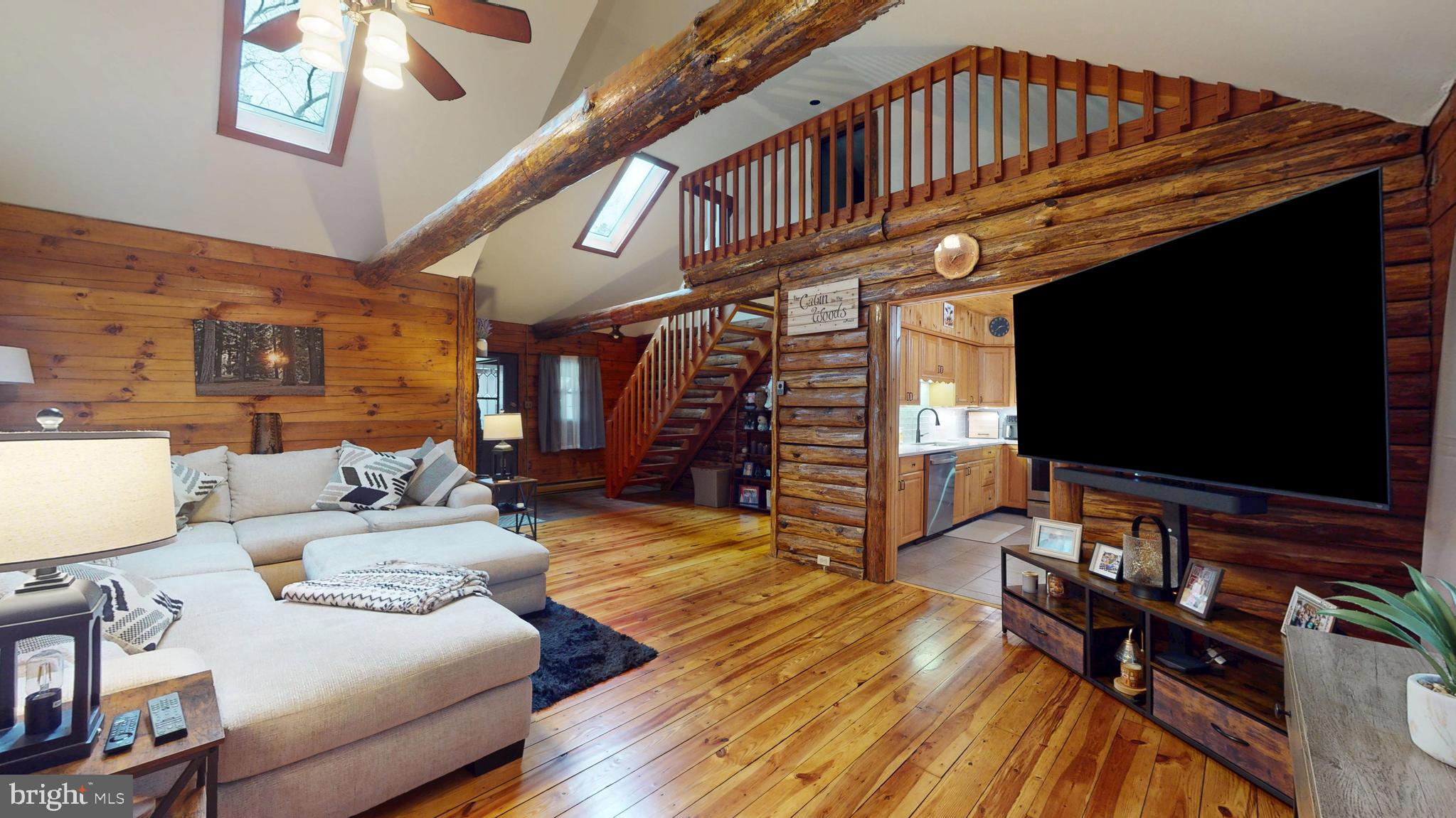 853 Clarks Landing Road Egg Harbor City, NJ 08215 - Photo 38 of 62 a living room with furniture and a flat screen tv