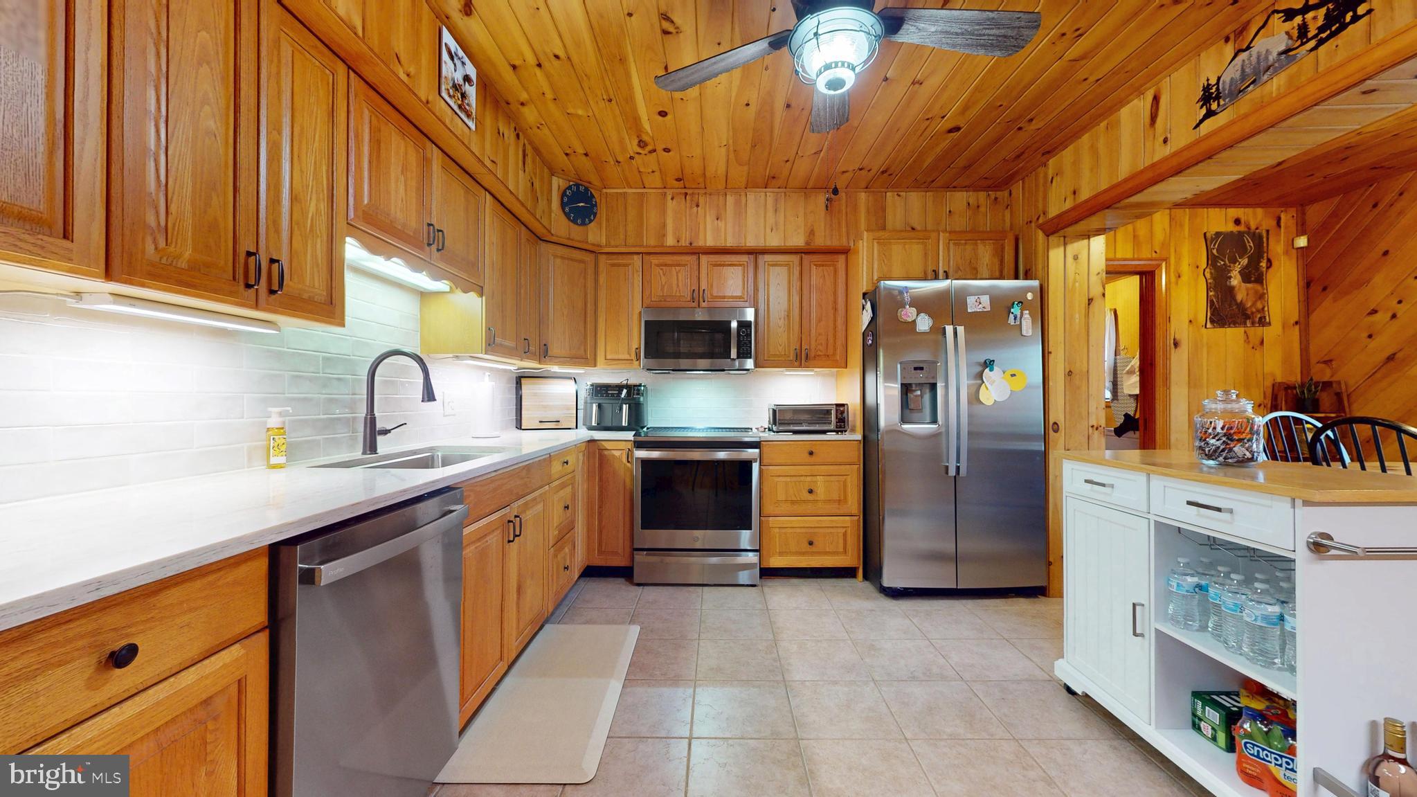 853 Clarks Landing Road Egg Harbor City, NJ 08215 - Photo 40 of 62 a kitchen with refrigerator cabinets and a sink