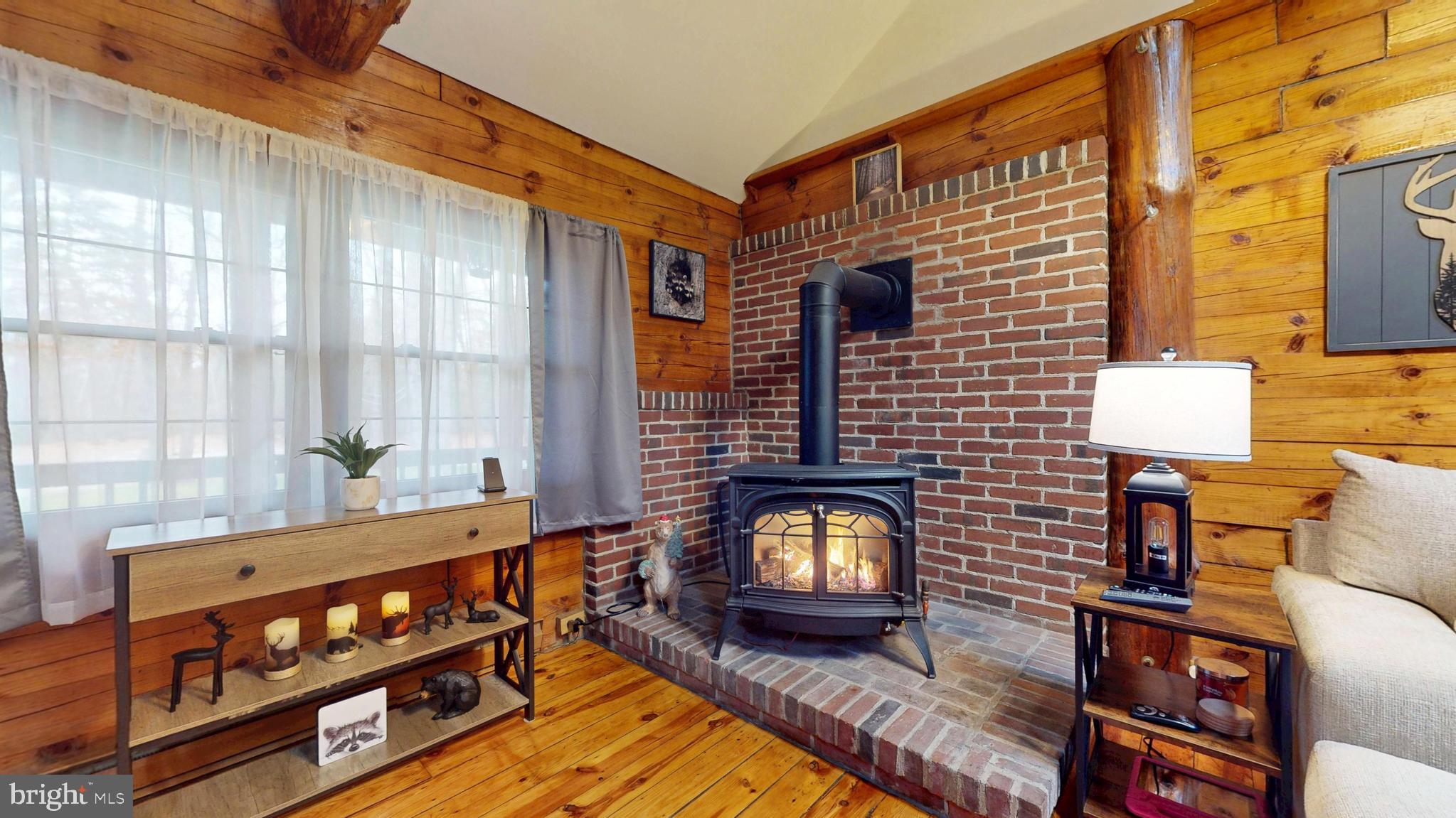 853 Clarks Landing Road Egg Harbor City, NJ 08215 - Photo 41 of 62 a living room with furniture and a fireplace