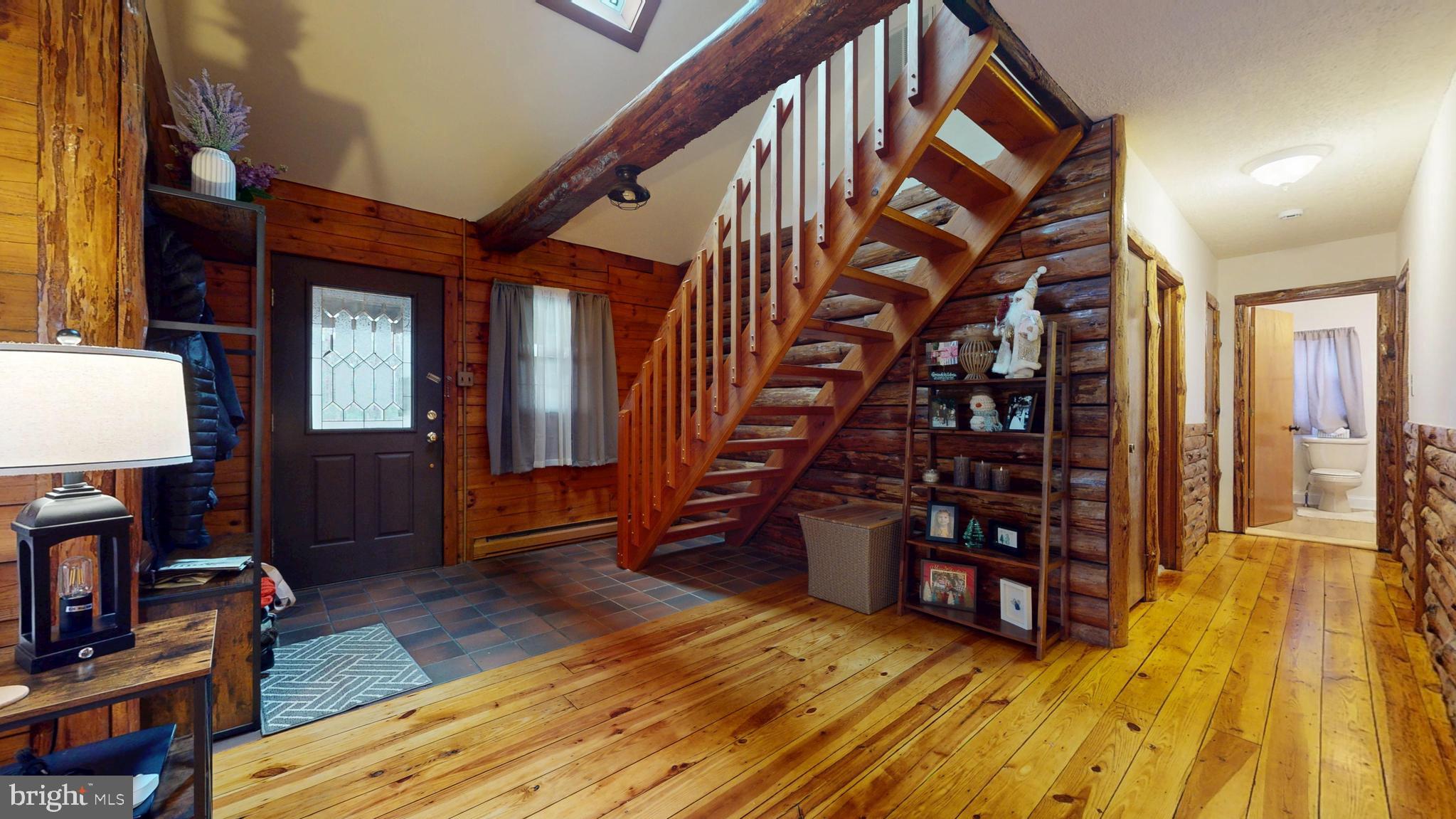853 Clarks Landing Road Egg Harbor City, NJ 08215 - Photo 50 of 62 a view of empty room with wooden floor and book shelf