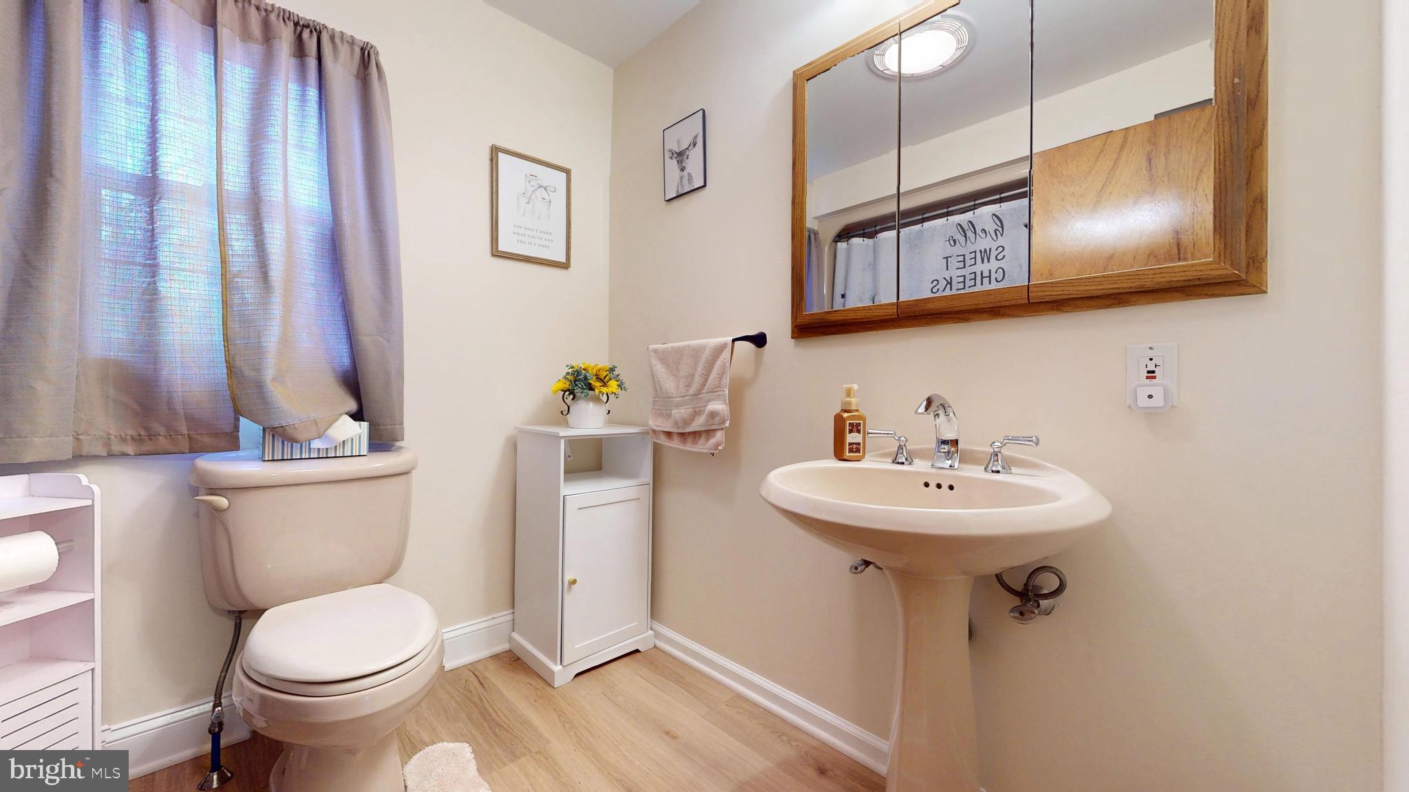 853 Clarks Landing Road Egg Harbor City, NJ 08215 - Photo 57 of 62 a bathroom with a toilet sink and mirror