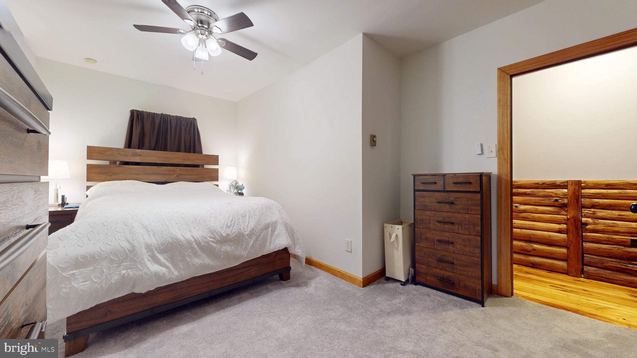 853 Clarks Landing Road Egg Harbor City, NJ 08215 - Photo 58 of 62 a bedroom with a bed and a chandelier