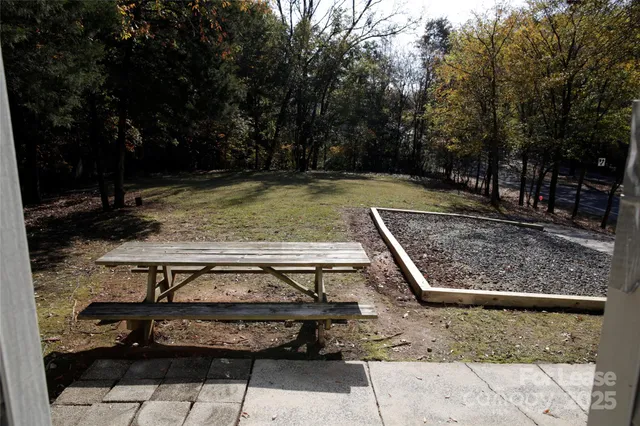 a view of a swimming pool with a yard