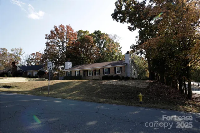 a house that has a tree in front of it