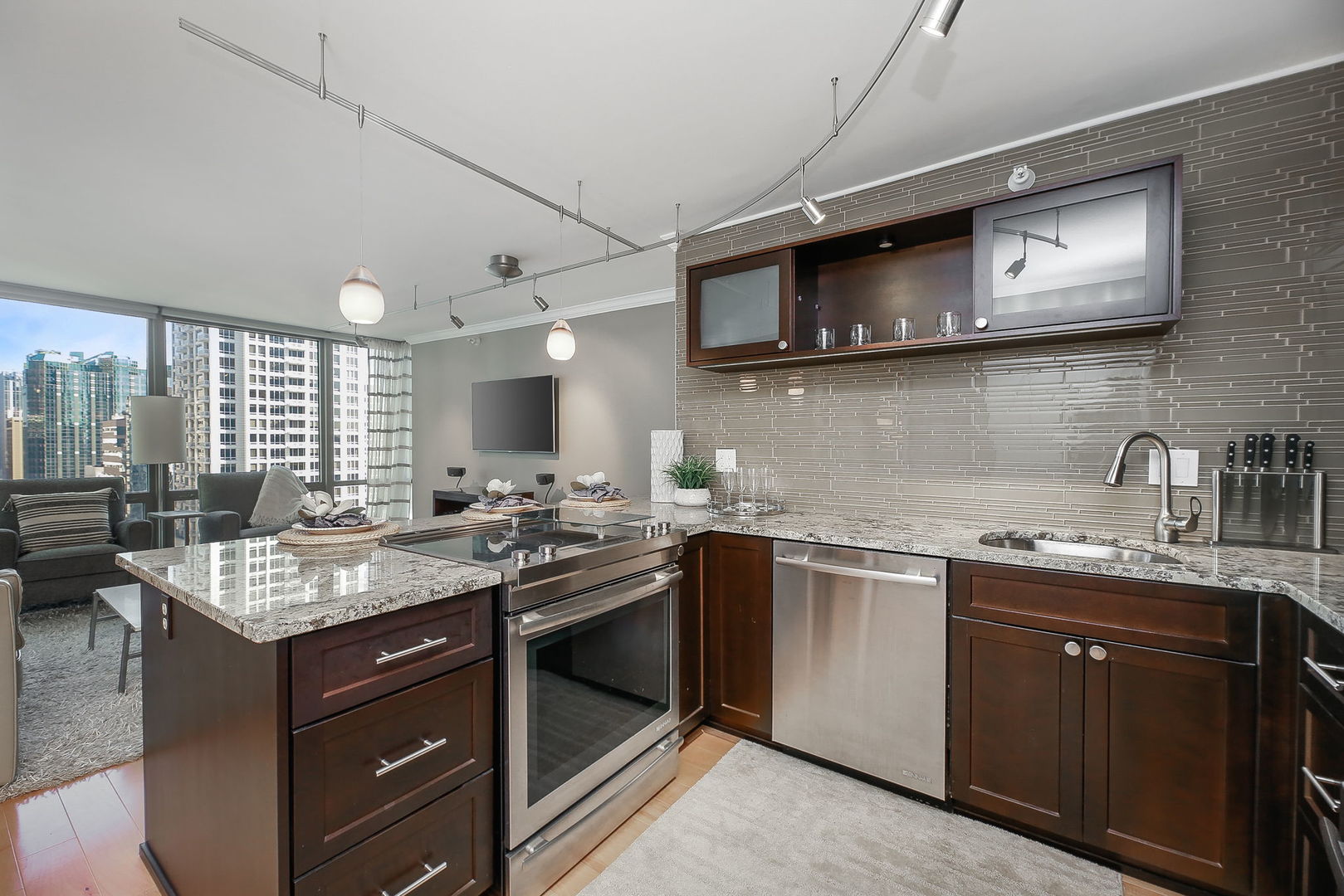 2 East Erie Street, Unit 2101 Chicago, IL 60611 - Photo 8 of 13 a kitchen with a sink stove and microwave
