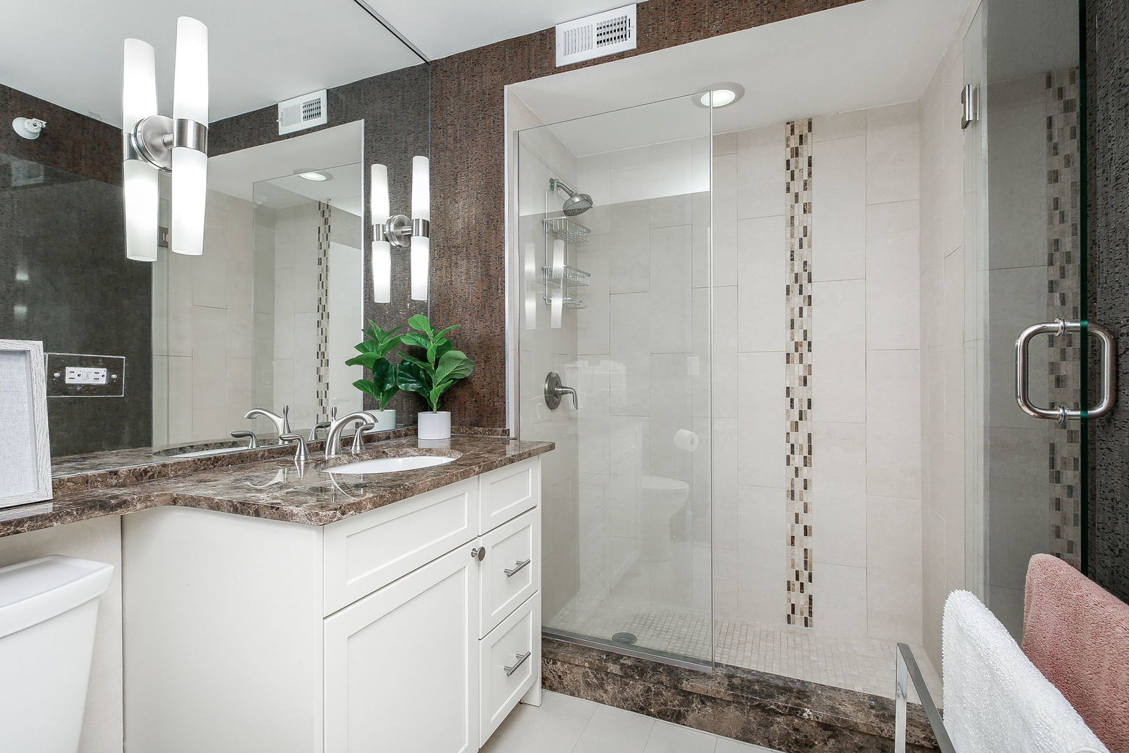2 East Erie Street, Unit 2101 Chicago, IL 60611 - Photo 10 of 13 a bathroom with a granite countertop sink a mirror and a shower