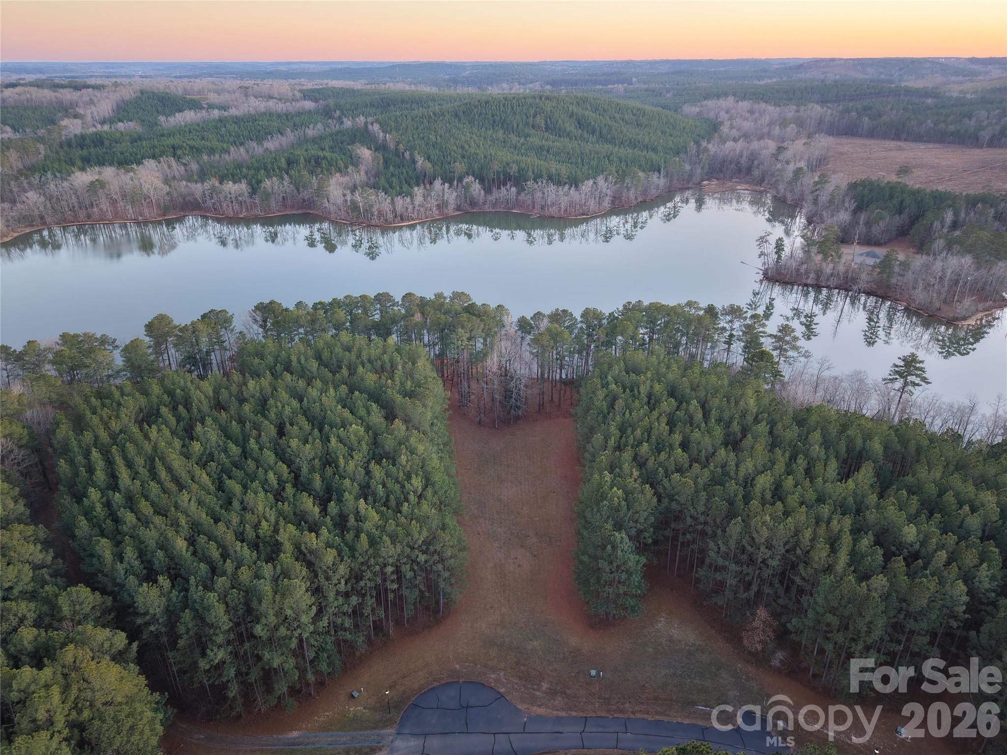 Tbd Tbd Spencer Pointe Road Lilesville, NC 28091 - Photo 7 of 19 a view of a lake with a mountain