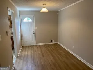 wooden floor in an empty room with a mirror