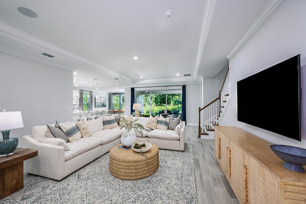 86646 Swift Launch Path Yulee, FL 32097 - Photo 11 of 30 a living room with furniture and a flat screen tv