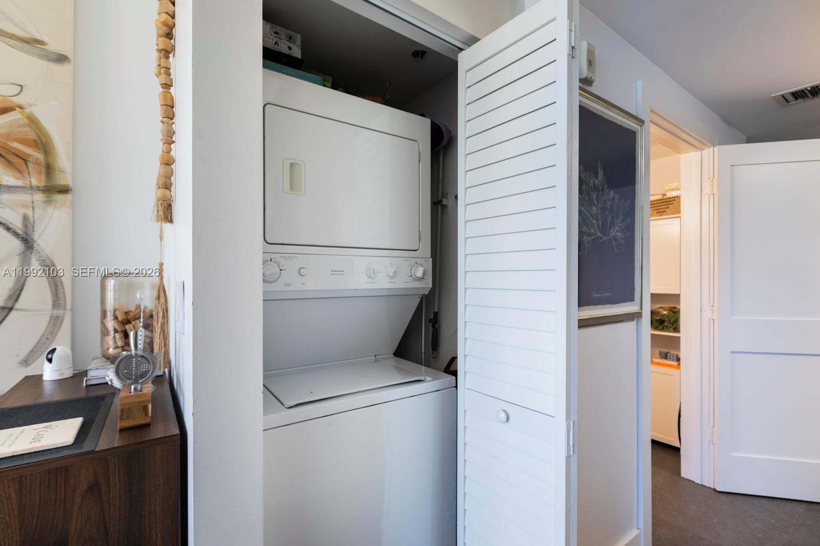 3339 Virginia Street, Unit 311 Miami, FL 33133 - Photo 12 of 16 a utility room with dryer and washer