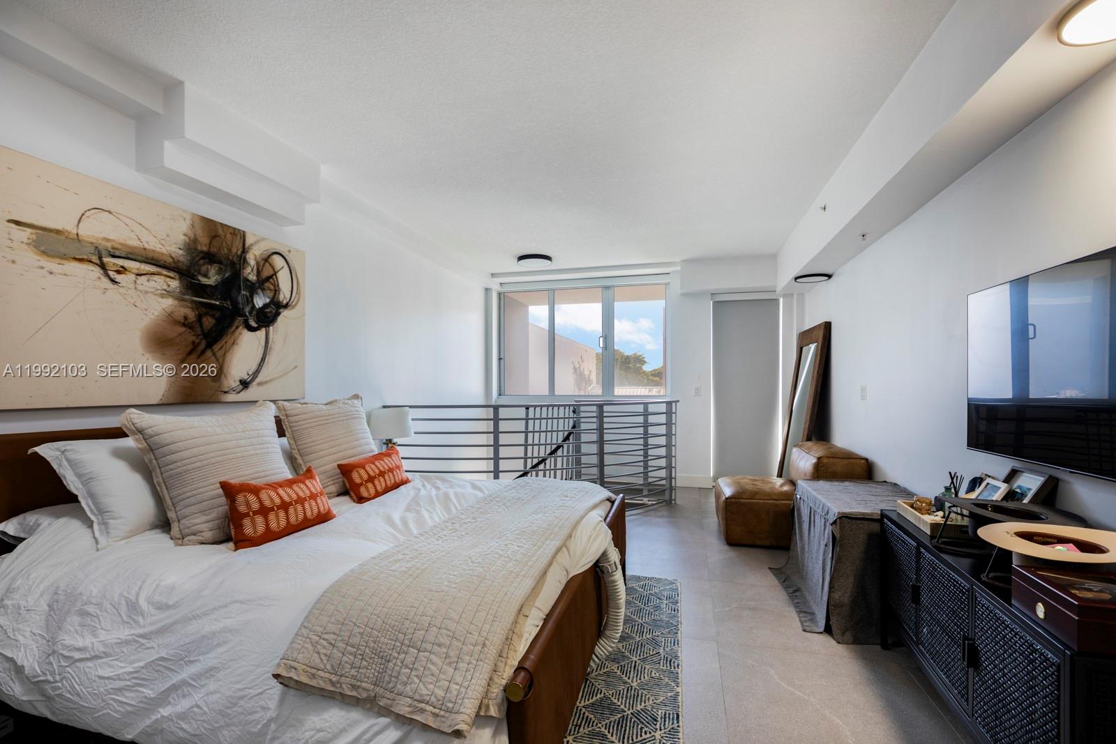 3339 Virginia Street, Unit 311 Miami, FL 33133 - Photo 14 of 16 a bedroom with furniture and a window
