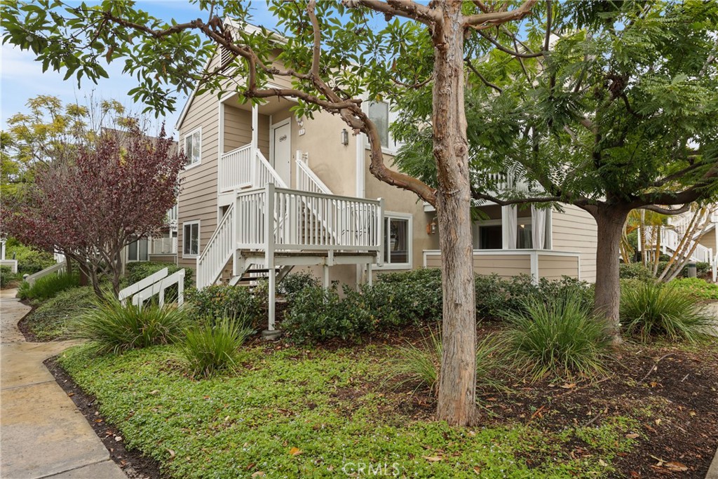 34032 Selva Road, Unit 96 Dana Point, CA 92629 - Photo 3 of 41 a white house that has a tree in front of the house