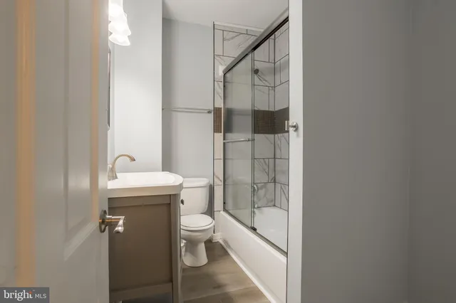 a roof deck with table and chairs a barbeque with wooden floor and roof