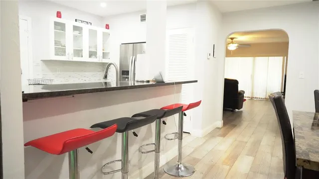 a view of hallway with seating area