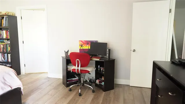 a view of workspace with wooden floor door