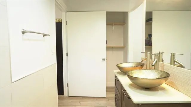 a view of a bathroom with a tub and sink