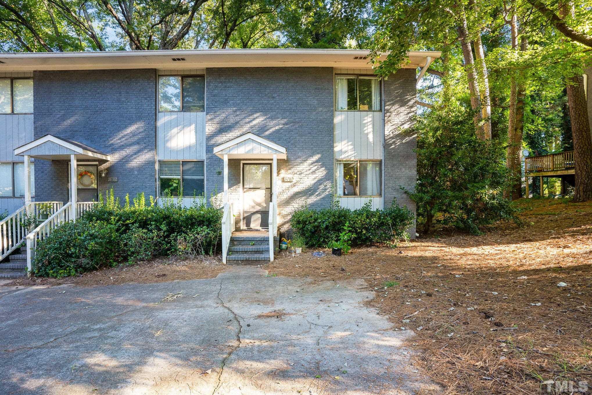3710 Greenleaf Street Raleigh, NC 27606 - Photo 1 of 12 a front view of a house with garden