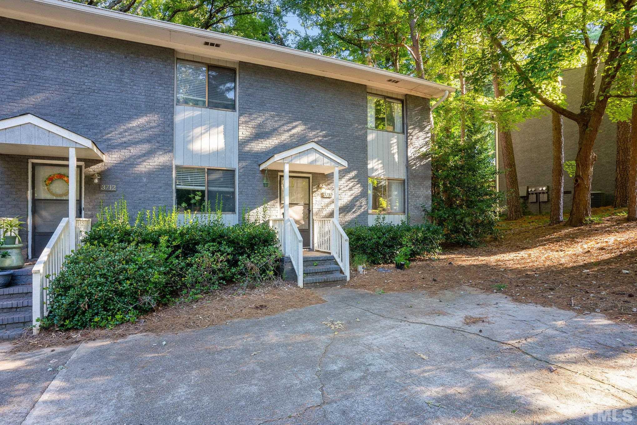 3710 Greenleaf Street Raleigh, NC 27606 - Photo 2 of 12 a front view of a house with garden