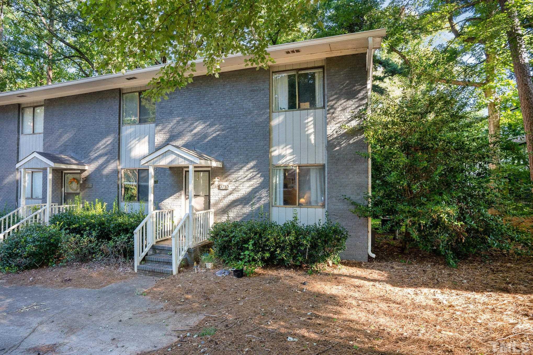 3710 Greenleaf Street Raleigh, NC 27606 - Photo 3 of 12 a front view of a house with a yard