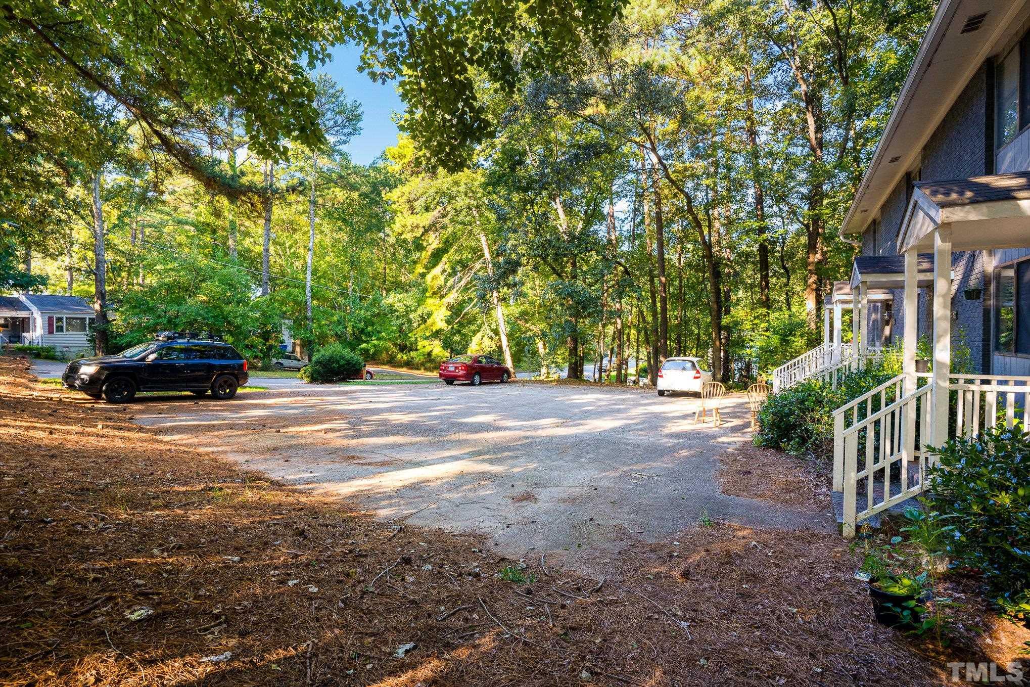 3710 Greenleaf Street Raleigh, NC 27606 - Photo 5 of 12 a view of street with parked cars