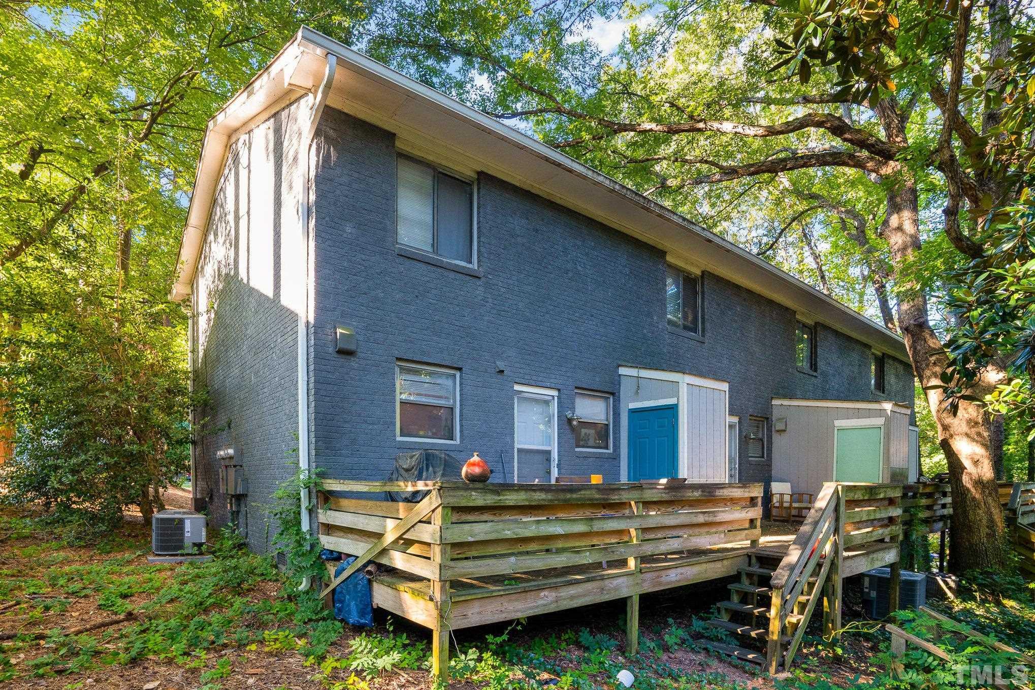 3710 Greenleaf Street Raleigh, NC 27606 - Photo 6 of 12 a view of a house with a yard and sitting area