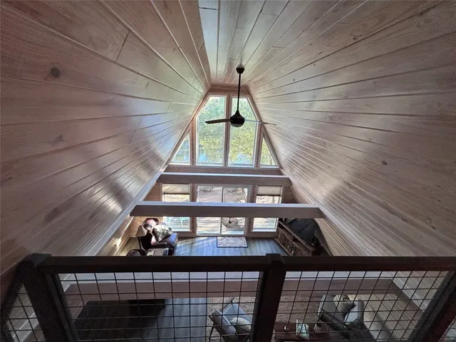 a bedroom with a bed and a mirror