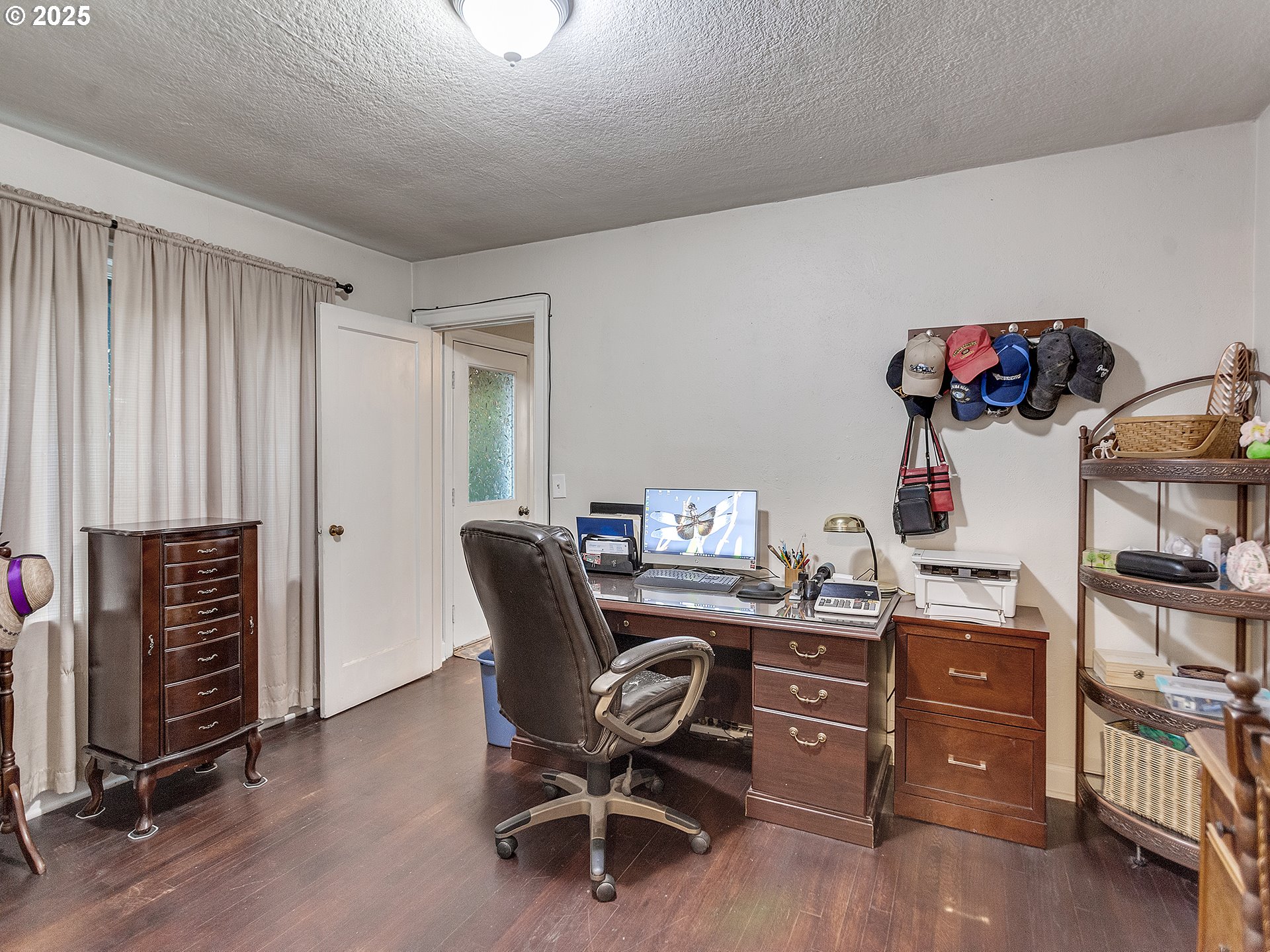 299 Southwest 3rd Avenue Canby, OR 97013 - Photo 13 of 32 a view of a workspace with furniture and a window