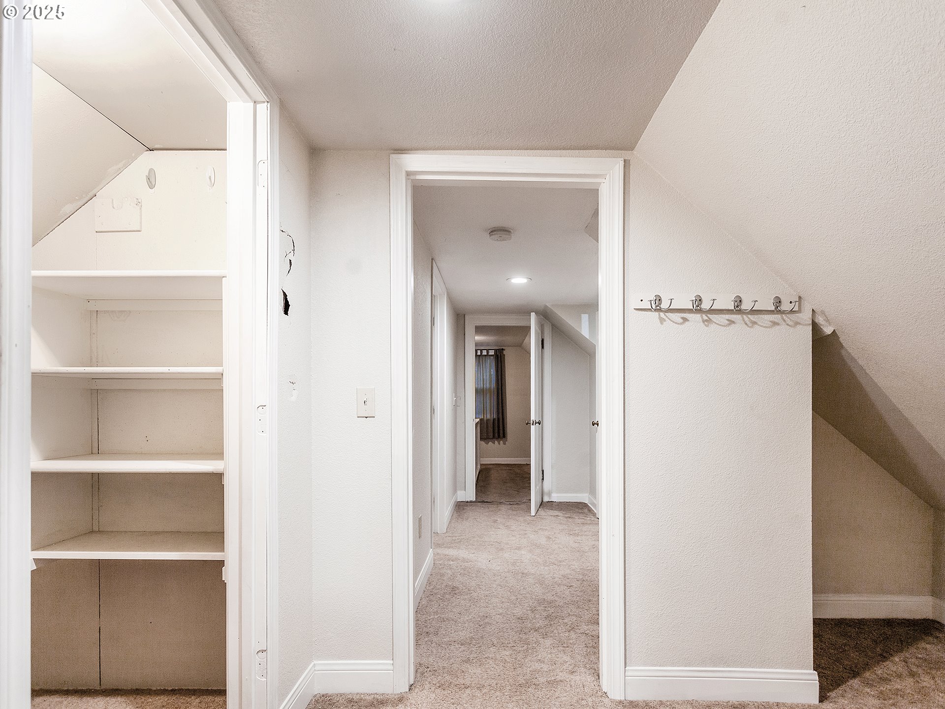 299 Southwest 3rd Avenue Canby, OR 97013 - Photo 17 of 32 a view of a hallway with closet and a bathroom