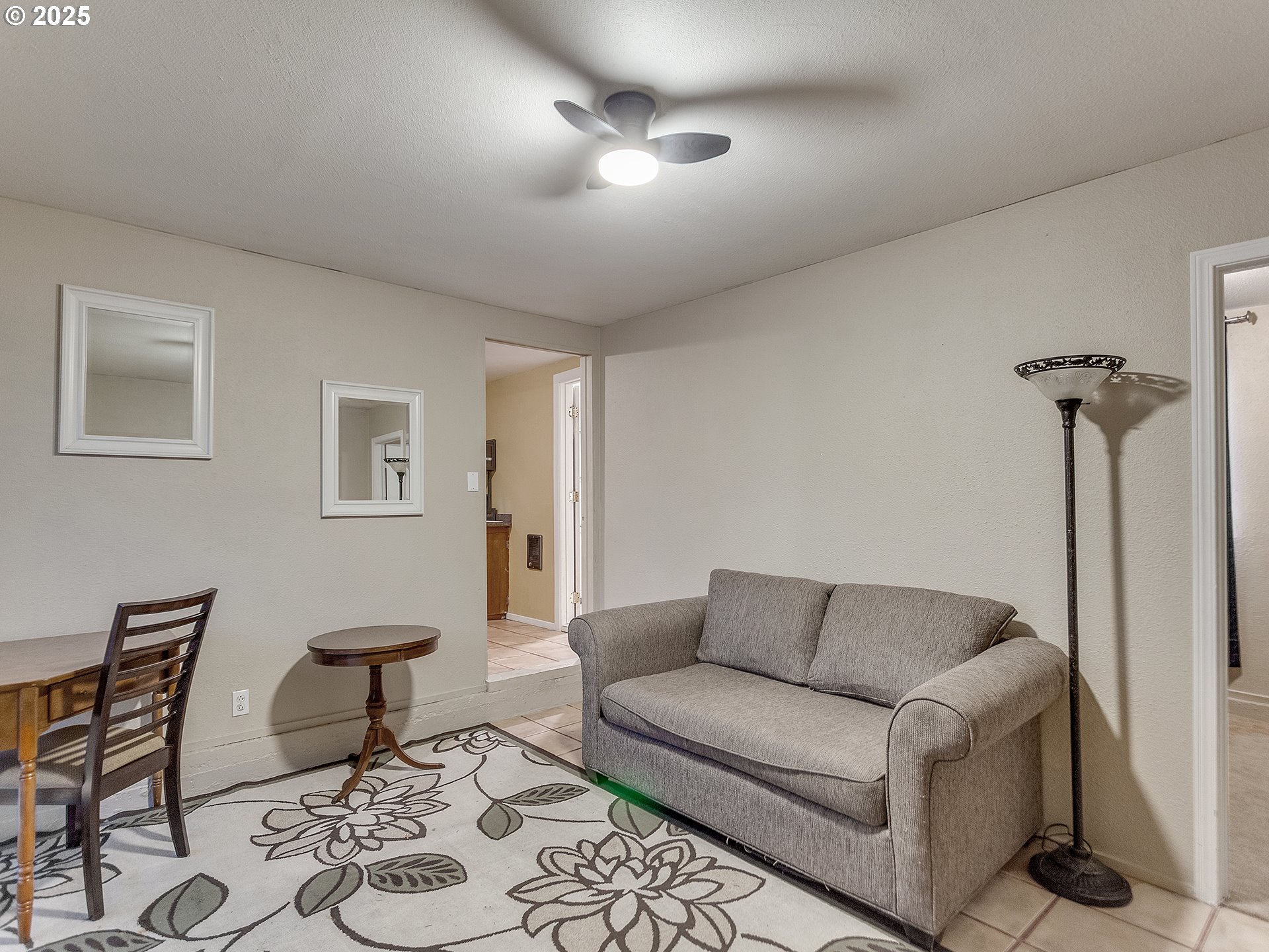 299 Southwest 3rd Avenue Canby, OR 97013 - Photo 22 of 32 a living room with furniture and a chandelier