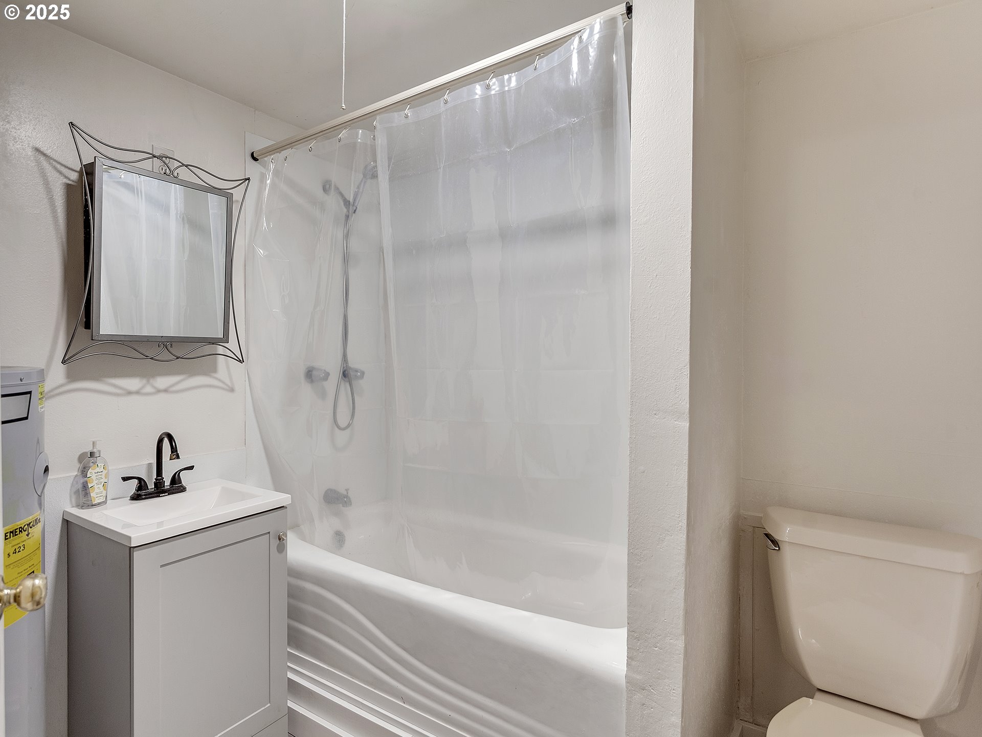 299 Southwest 3rd Avenue Canby, OR 97013 - Photo 26 of 32 a bathroom with a shower a toilet and a sink