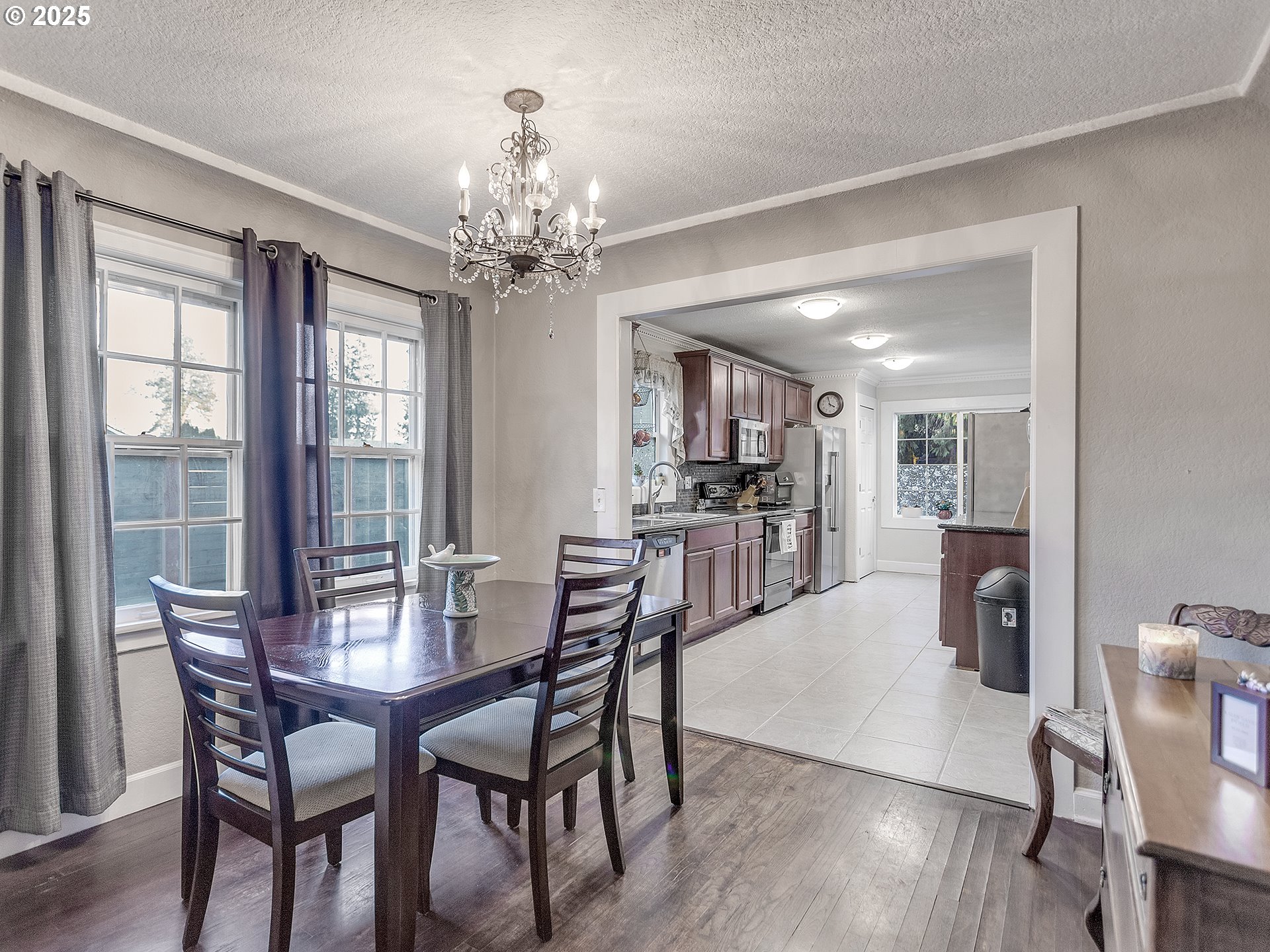299 Southwest 3rd Avenue Canby, OR 97013 - Photo 6 of 32 a view of a dining room with furniture window and wooden floor