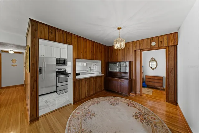 a kitchen with granite countertop a refrigerator and a sink