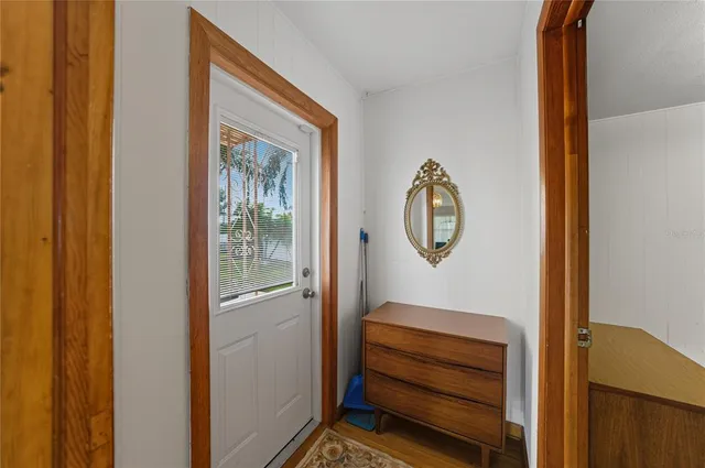 a room with painting and a wooden door