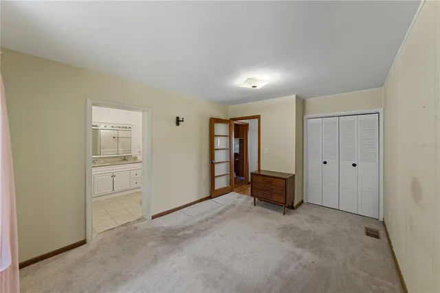 a big room with closet and entryway