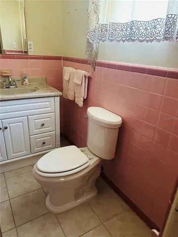 a bathroom with a sink and vanity