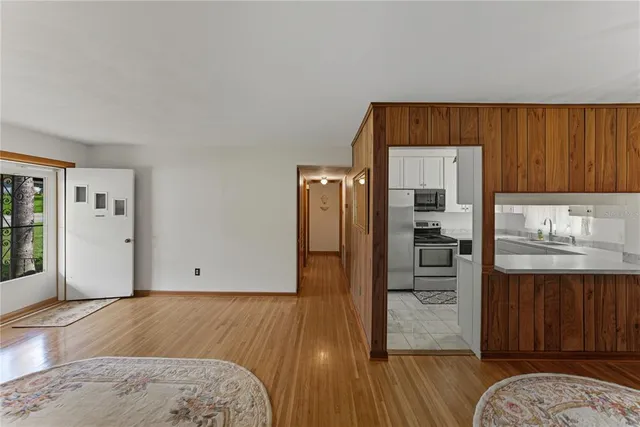 a view of bedroom with furniture and wooden floor