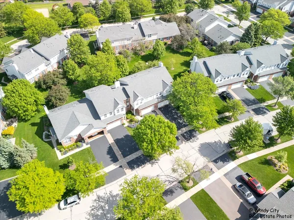 an aerial view of residential house with outdoor space and street view