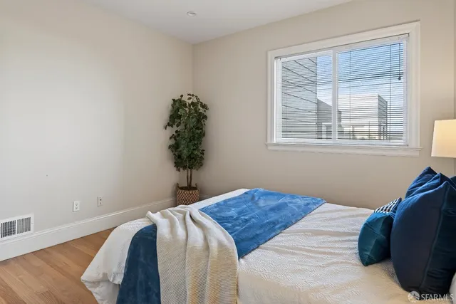 a view of a livingroom with wooden floor